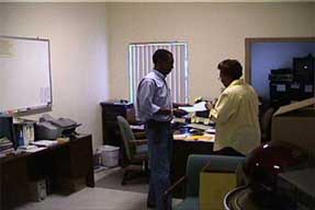 Fair Deal team member helping a customer in the office